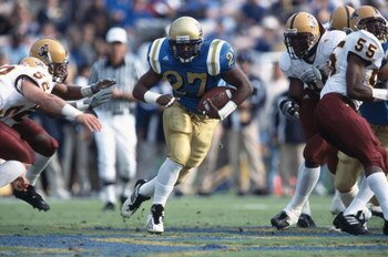 1 Dec 2001:  Akil Harris #27 of the UCLA Bruins runs away from Mason Unck #52 of the Arizona State Sun Devils during the Pac-10 Conference football game at the Rose Bowl in Pasadena, California.  The Bruins defeated the Sun Devils 52-42.Mandatory Credit: 
