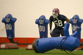 ORCHARD PARK, NY - MAY 01:  Aaron Maybin #58, 2009 first round draft pick of the Buffalo Bills runs a drill  during Buffalo Bills minicamp at the Buffalo Bills Fieldhouse on May 1, 2009 in Orchard Park, New York.  (Photo by Rick Stewart/Getty Images)