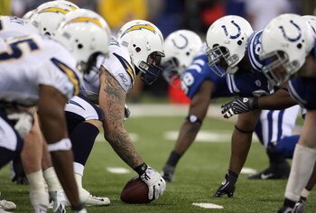 INDIANAPOLIS - JANUARY 13:  Center Nick Hardwick #61 of the San Diego Chargers centers the ball at the line of scrimmage on offense against the Indianapolis Colts during their AFC Divisional Playoff game at the RCA Dome on January 13, 2008 in Indianapolis