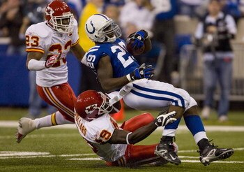 INDIANAPOLIS - NOVEMBER 18:  Joseph Addai #29 of the Indianapolis Colts is tackled by Bernard Pollard #49 of the Kansas City Chiefs on November 18, 2007 at the RCA Dome in Indianapolis, Indiana. The Colts defeated the Chiefs 13-10.  (Photo by Dilip Vishwa