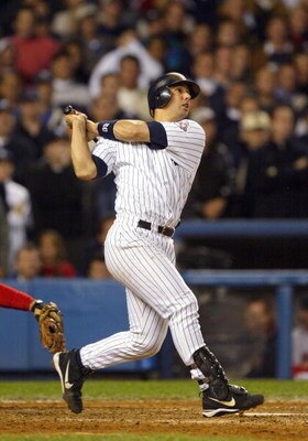 BRONX, NY - OCTOBER 16:  Jorge Posada #20 of the New York Yankees hits the game tying double in the eighth inning to score two runs against the Boston Red Sox during game 7 of the American League Championship Series on October 16, 2003 at Yankee Stadium i