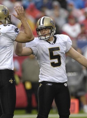 TAMPA, FL - NOVEMBER 30: Kicker Garrett Hartley #5 of the New Orleans Saints high fives after a conversion against the Tampa Bay Buccaneers at Raymond James Stadium on November 30, 2008 in Tampa, Florida.  (Photo by Al Messerschmidt/Getty Images) 