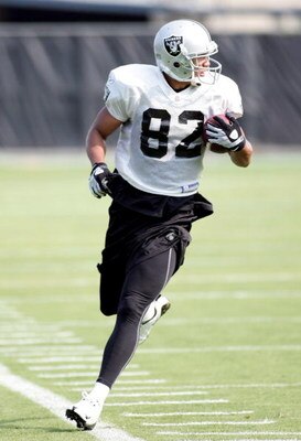 NAPA, CA - JULY 25:  Wide receiver Chaz Schilens #82 runs with the ball during a morning session as the Oakland Raiders start their camp at the Marriott Hotel on July 25, 2008 in Napa, California. (Photo by Sara Wolfram/Getty Images)