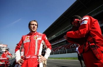 MONTMELO;SPAIN - FEBRUARY 22: Luca Badoer chats to race engineer Chris Dyer during the Ferrari Formula One testing session at the Circuit de Catalunya on February 22, 2008 in Montmelo near Barcelona, Spain. (Photo by Getty Images for Shell)