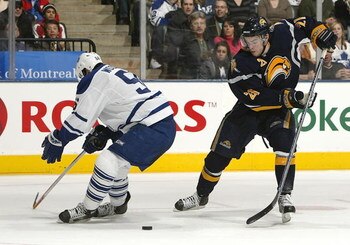TORONTO - FEBRUARY 27:  Drew Stafford #21of the Buffalo Sabres beats Andy Wozniewski #56 of the Toronto Maple Leafs on this play in NHL action at the Air Canada Centre February 27, 2007 in Toronto, Ontario.  (Photo By Dave Sandford/Getty Images)
