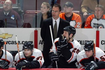 PHILADELPHIA - NOVEMBER 2:  Head coach John Stevens of the Philadelphia Flyers looks on from behind the bench against the Tampa Bay Lightning on November 2, 2006 at the Wachovia Center in Philadelphia, Pennsylvania.  The Lightning won 5-2.  (Photo by Chri