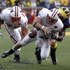 ANN ARBOR, MI - SEPTEMBER 27: Allan Evridge #4 of the Wisconsin Badgers fumbles the ball late in the forth quarter on a hit by Brandon Graham #55 of the Michigan Wolverines on September 27, 2008 at Michigan Stadium in Ann Arbor, Michigan. (Photo by Gregor