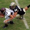 WEST LAFAYETTE, IN - SEPTEMBER 20:  Quarterback Dan LeFevour #13 of the Central Michigan Chippewas is tackled by Ryan Kerrigan #94 of the Purdue Boilermakers at Ross-Ade Stadium on September 20, 2008 in West Lafayette, Indiana.  (Photo by Ronald Martinez/
