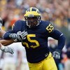 ANN ARBOR, MI - SEPTEMBER 15:  Brandon Graham #55 of the Michigan Wolverines pass rushes against the Notre Dame Fighting Irish on September 15, 2007 at Michigan Stadium in Ann Arbor, Michigan. Michigan won 38-0. (Photo by Gregory Shamus/Getty Images)  