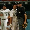 MIAMI - JUNE 9: Cody Ross #12 of the Florida Marlins argues with Home Plate Umpire Bill Hohn and gets tossed from the game in the 8th inning against the Cincinnati Reds on June 9, 2008 at Dolphin Stadium in Miami, Florida. (Photo by Eliot J. Schechter/Get