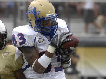 ORLANDO, FL - OCTOBER 20: Wide receiver Trae Johnson #83 of the Tulsa Golden Hurricane grabs a pass against the University of Central Florida Knights at Bright House Stadium on October 20, 2007 in Orlando, Florida.  UCF won 44 - 23. (Photo by Al Messersch