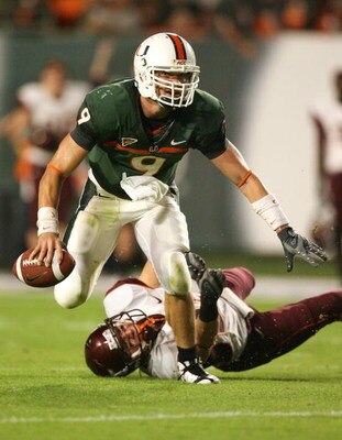 MIAMI - NOVEMBER 13:  Quarterback Robert Marve #9 of the Miami Hurricanes breaks away from the pressure from linebacker Cody Grimm #26 of the Virginia Tech Hokies at Dolphin Stadium on November 13, 2008 in Miami, Florida. Miami defeated Virginia Tech 16-1