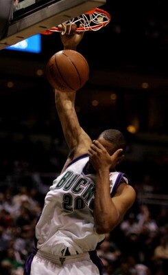 MILWAUKEE - MAY 01:  Jamaal Magloire #20 of the Milwaukee Bucks covers his eyes on a dunk against the Detroit Pistons in Game 4 of the Eastern Conference Quarterfinals during the 2006 NBA Playoffs May 1, 2006 at the Bradley Center in Milwaukee, Wisconsin.