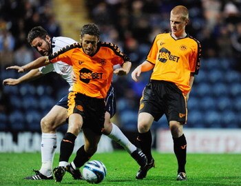 PRESTON, UNITED KINGDOM - JULY 28:  Preston's Jon Parkin challenges Michael Brown and Ben Watson during a pre season friendly match between Preston North End and Wigan Athletic at Deepdale on July 28, 2009 in Preston, United Kingdom.  (Photo by Michael Re