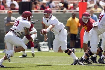LOS ANGELES, CA - APRIL 25: Quarterback Matt Barkley #7 of the USC Trojans hands off the ball during the spring game on April 25, 2009 at the Los Angeles Memorial Coliseum in Los Angeles, California.  The cardinal team won 16-10.  (Photo by Jeff Golden/Ge