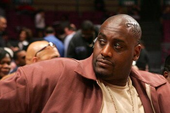 NEW YORK - MARCH 07:  Former New York Knick Anthony Mason watches as his son Anthony Mason Jr. #2 of the St. Johns Red Storm takes on the Marquette Golden Eagles during the first round of the Big East Championship at Madison Square Garden On March 7, 2007