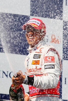BUDAPEST, HUNGARY - JULY 26:  Lewis Hamilton of Great Britain and McLaren Mercedes celebrates on the podium after winning the Hungarian Formula One Grand Prix at the Hungaroring on July 26, 2009 in Budapest, Hungary.  (Photo by Mark Thompson/Getty Images)