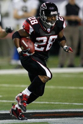 ATLANTA - DECEMBER 10:  Warrick Dunn #28 of the Atlanta Falcons carries the ball against the New Orleans Saints on December 10, 2007 at the Georgia Dome in Atlanta, Georgia. The Saints defeated the Falcons 34-14.   (Photo by Chris Graythen/Getty Images)