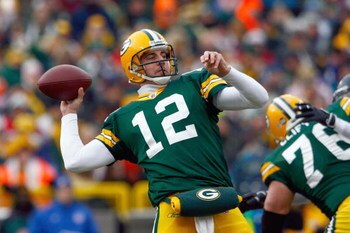 GREEN BAY - DECEMBER 7:  Quarterback Aaron Rodges #12 of the Green Bay Packers passes the ball during the game against the Houston Texans at Lambeau Field on December 7, 2008 in Green Bay, Wisconsin.  ( Photo by: Jeff Gross/Getty Images)