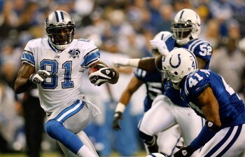 INDIANAPOLIS - DECEMBER 14:  Calvin Johnson #81 of the Detroit Lions gets past Antoine Bethea #41 of the Indianapolis Colts to score a touchdown on December 14, 2008 at Lucas Oil Stadium in Indianapolis, Indiana.  (Photo by Chris Graythen/Getty Images)