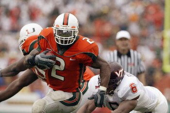MIAMI - DECEMBER 7:  Running back Willis McGahee #2 of the University of Miami Hurricanes evades linebacker Vegas Robinson #6 of the Virginia Polytechnic Institute and State University Hokies during the game at the Orange Bowl on December 7, 2002 in Miami