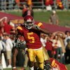 LOS ANGELES, CA - DECEMBER 03:  Reggie Bush #5 of the USC Trojans rushes the ball against the UCLA Bruins December 3, 2005 at the Los Angeles Memorial Coliseum in Los Angeles, California. USC won 66-19.  (Photo by Stephen Dunn/Getty Images)