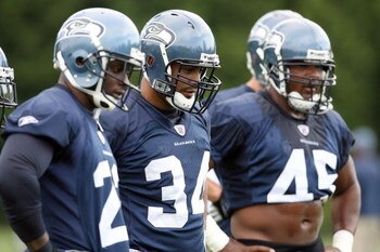 KIRKLAND, WA - JULY 25:  David Kirtman #34 of the Seattle Seahawks stands on the field with Julius Jones #22 and T.J. Duckett #45 during training camp at the Seahawks Training Facility on July 25, 2008 in Kirkland, Washington. (Photo by Otto Greule Jr/Get