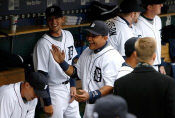 DETROIT - MARCH 31:  Miguel Cabrera #24 and Clete Thomas #36 of the Detroit Tigers share a laugh in the dugout against the Kansas City Royals during their game on Opening Day on March 31, 2008 at Comerica Park in Detroit, Michigan. Royals won 5-4 in 11 in