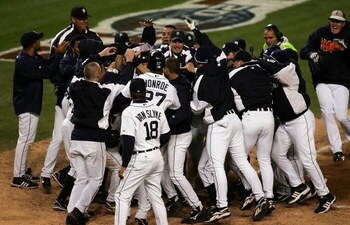 DETROIT - OCTOBER 14:  The Detroit Tigers crowd around Magglio Ordonez #30, after Ordonez hit a 3-run walk-off home run against Huston Street #20 of the Oakland Athletics during Game Four of the American League Championship Series October 14, 2006 at Come