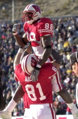 29 Dec 2000:  Chris Chambers #88 of  Wisconsin is hoisted in the air by teammate Mark Anelli #81 after Chambers scores a touchdown in the third quarter against UCLA during the Sun Bowl at Sun Bowl Stadium in El Paso, Texas.  Wisconsin beat UCLA 21-20.  DI