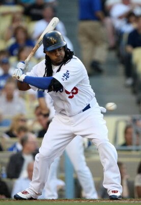 LOS ANGELES - JULY 16: Manny Ramirez #99 of the Los Angeles Dodgers bats in the first inning against the Houston Astros on July 16, 2009 at Dodger Stadium in Los Angeles, California. (Photo by Stephen Dunn/Getty Images)