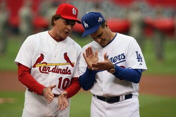 ST. LOUIS, MO - JULY 14:  National League All-Star coaches Tony La Russa of the St. Louis Cardinals and Joe Torre of the Los Angeles Dodgers clap during introductions before the 2009 MLB All-Star Game at Busch Stadium on July 14, 2009 in St. Louis, Missou