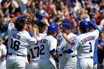 CHICAGO - MAY 16: (L-R) Geovaney Soto #18, Mike Fontenot #17, Ryan Theriot #2, Ryan Dempster #46 and Kosuke Fukudome #1 of the Chicago Cubs greet teammate Alfonso Soriano #12 after Soriano drove in the game-winning run in the 9th inning against the Housto