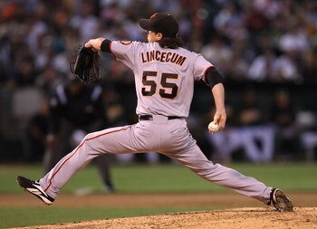 OAKLAND, CA - JUNE 23:  Tim Lincecum #55 of the San Francisco Giants pitches against the Oakland Athletics during a Major League Baseball game on June 23, 2009 at the Oakland Coliseum in Oakland, California.  (Photo by Jed Jacobsohn/Getty Images)