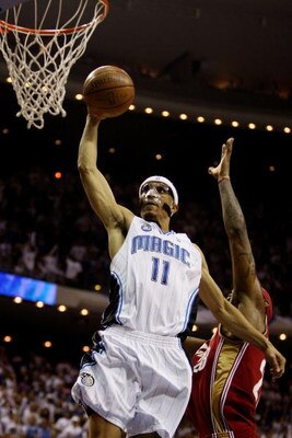 ORLANDO, FL - MAY 24:  Courtney Lee #11 of the Orlando Magic shoots against LeBron James #23 of the Cleveland Cavaliers in Game Three of the Eastern Conference Finals during the 2009 NBA Playoffs at the the Amway Arena on May 24, 2009 in Orlando, Florida.