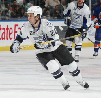 UNIONDALE, NY - APRIL 04: Martin St. Louis #26 of the Tampa Bay Lightning skates against the New York Islanders in a National Hockey League game at Nassau Coliseum on April 4, 2009 in Uniondale, New York. (Photo by Paul Bereswill/Getty Images)