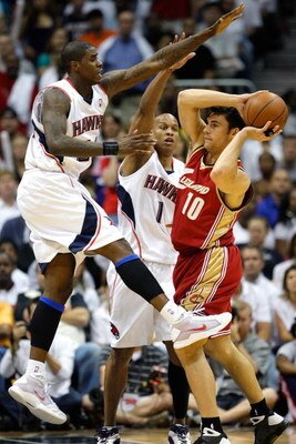 ATLANTA - MAY 11:  Marvin Williams and Maurice Evans #1 of the Atlanta Hawks defend against Wally Szczerbiak #10 of the Cleveland Cavaliers during Game Four of the Eastern Conference Semifinals during the 2009 NBA Playoffs at Philips Arena on May 11, 2009