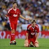 BARCELONA, SPAIN - AUGUST 02:  Fernando Torres (R) of Liverpool reacts after being fouled backdropped by teammate Steven Gerrard during the pre-season friendly match between Espanyol and Liverpool at the Nuevo Estadio de Cornella-El Prat on August 2, 2009