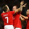 MANCHESTER, ENGLAND - AUGUST 05:  Wayne Rooney of Manchester United celebrates with Michael Owen after scoring the opening goal during a pre season friendly match between Manchester United and Vallencia at Old Trafford on August 5, 2009 in Manchester, Eng