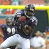 MIAMI, FL - JANUARY 4:  Safety Ed Reed #20 of the Baltimore Ravens intercepts a pass against the Miami Dolphins in an AFC wild card game at Dolphins Stadium January 4, 2009 in Miami, Floirda.  Reed ran the interception back for a touchdown. (Photo by Al M