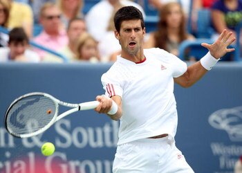 CINCINNATI - AUGUST 23:  Novak Djokovic of Serbia hits a forehand against Roger Federer of Switzerland in the Singles Final during day seven of the Western & Southern Financial Group Masters on August 23, 2009 at the Lindner Family Tennis Center in Cincin