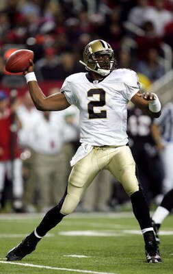 ATLANTA - DECEMBER 12:  Aaron Brooks #2 of the New Orleans Saints looks to pass against the Atlanta Falcons in NFL action December 12, 2005 at the Georgia Dome in Atlanta, Georgia.  (Photo By Streeter Lecka/Getty Images)