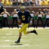 ANN ARBOR, MI - SEPTEMBER 19:  Quarterback Tate Forcier #5 of the Michigan Wolverines carries the ball against the Eastern Michigan Eagles at Michigan Stadium on September 19, 2009 in Ann Arbor, Michigan.   Michigan won 45-17.  (Photo by Stephen Dunn/Gett