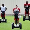 FLAGSTAFF, AZ - JULY 31: Quarterback Kurt Warner #13 of the Arizona Cardinals rides a segway across the field with teammates before the evening team training camp at Northern Arizona University on July 31, 2009 in Flagstaff, Arizona. (Photo by Christian P