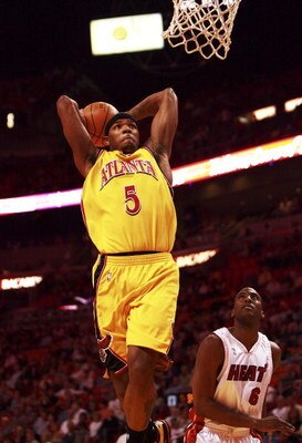 MIAMI - MARCH 26:  Josh Smith #5 of the Atlanta Hawks gets a dunk past Eddie Jones #6 of the Miami Heat at American Airlines Arena on March 26, 2007 in Miami, Florida. NOTE TO USER: User expressly acknowledges and agrees that, by downloading and or using 