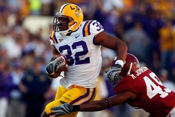BATON ROUGE, LA - NOVEMBER 08:  Charles Scott #32 of the Louisiana State University Tigers runs past Rashad Johnson #49 of the Alabama Crimson Tide on November 11, 2008 at Tiger Stadium in Baton Rouge, Louisiana.  (Photo by Chris Graythen/Getty Images)