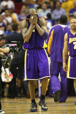 ORLANDO, FL - JUNE 14:  Kobe Bryant #24 of the Los Angeles Lakers covers his face with his jersey during Game Five of the 2009 NBA Finals against the Orlando Magic on June 14, 2009 at Amway Arena in Orlando, Florida. The Lakers won 99-86. NOTE TO USER:  U
