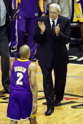 ORLANDO, FL - JUNE 14:  Head coach Phil Jackson of the Los Angeles Lakers claps as Derek Fisher #2 of the Lakers walks back to the bench in the first quarter against the Orlando Magic in Game Five of the 2009 NBA Finals on June 14, 2009 at Amway Arena in 