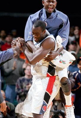 CHARLOTTE, NC - DECEMBER 14:   Theron Smith #0 jumps on teammate Emeka Okafor #50 of the Charlotte Bobcats after Okafor hit two free throws to win the game 94-93 against the New Orleans Hornets on December 14, 2004 at the Charlotte Coliseum in Charlotte, 