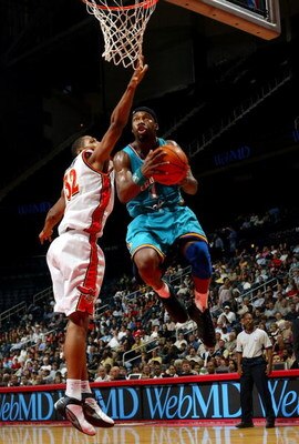 ATLANTA - NOVEMBER 3:  Baron Davis #1 of the New Orleans Hornets beats Boris Diaw #32 of the Atlanta Hawks during the game November 3, 2003  at Phillips Arena in Atlanta, Georgia. NOTE TO USER: User expressly acknowledges and agrees that, by downloading a